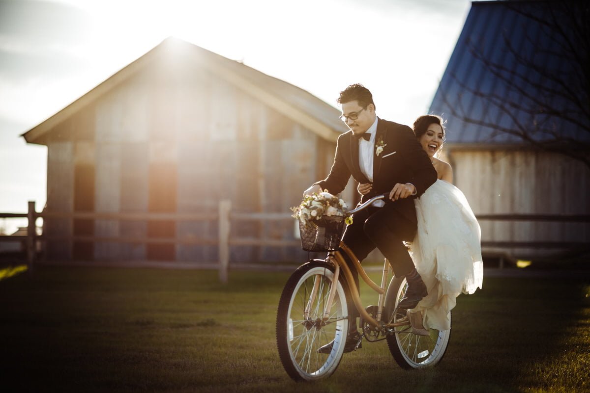 bride and groom ride a bike