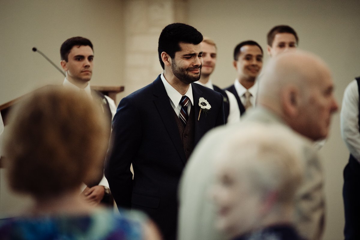 groom cries after seeing bride down the aisle