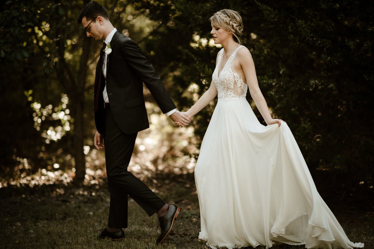 intimate walking shot of bride and groom