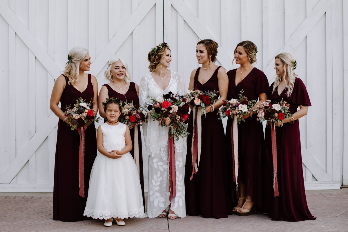 bridesmaids with maroon gowns