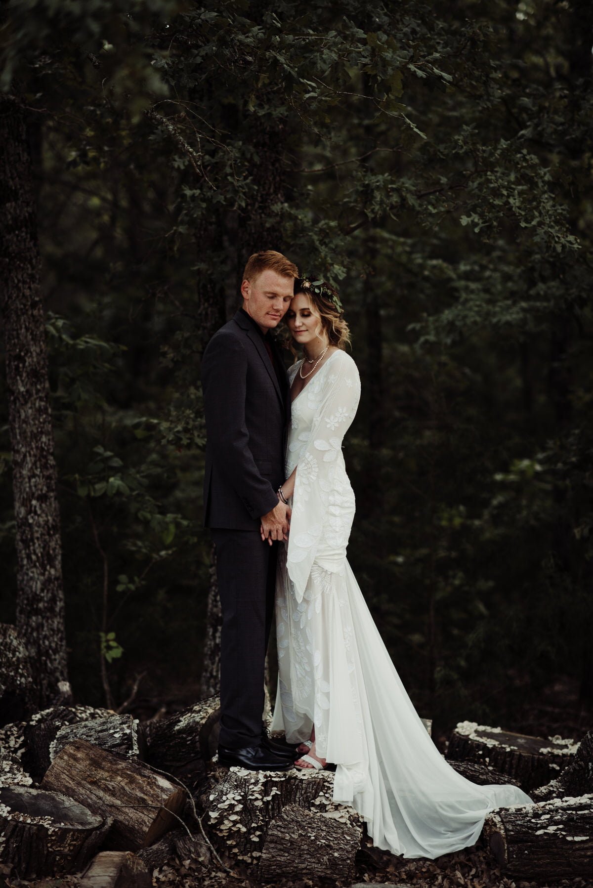 romantic bride and groom portrait in forest area