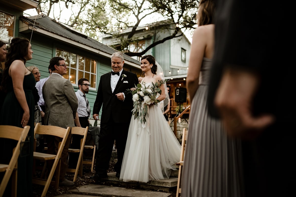 bride and father walk down aisle