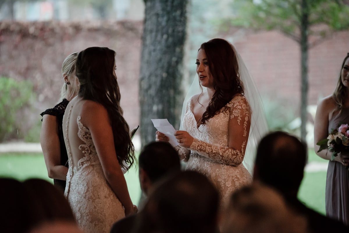 bride reads vows during ceremony