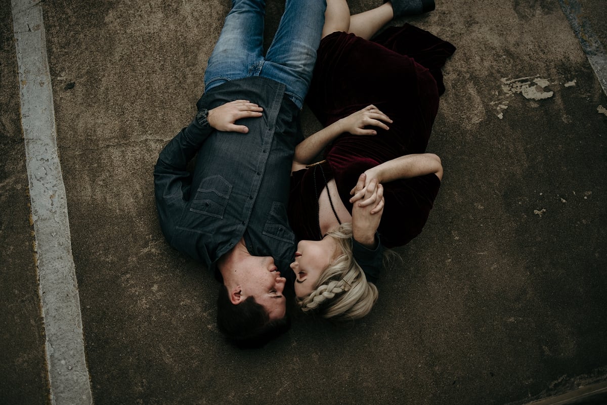 couple laying down on rooftop