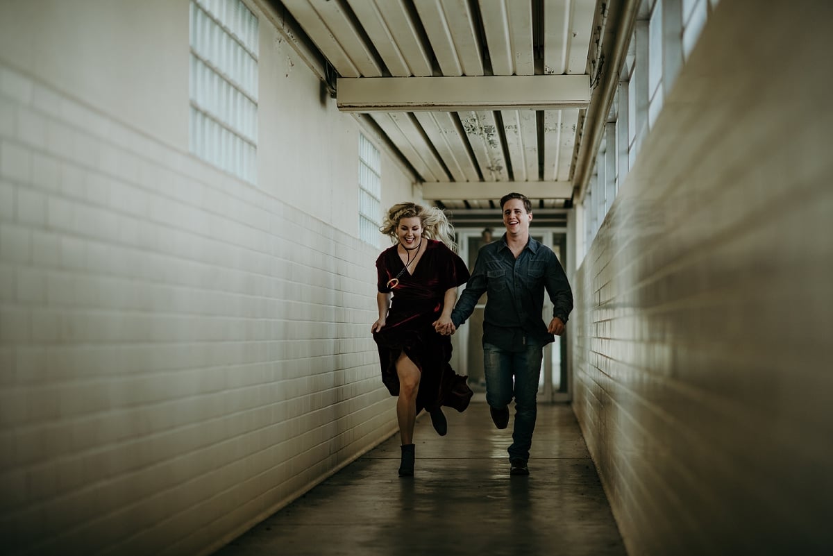 couple running down hallway