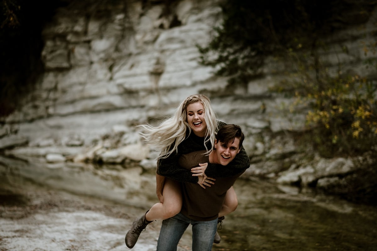 piggy back ride during engagement