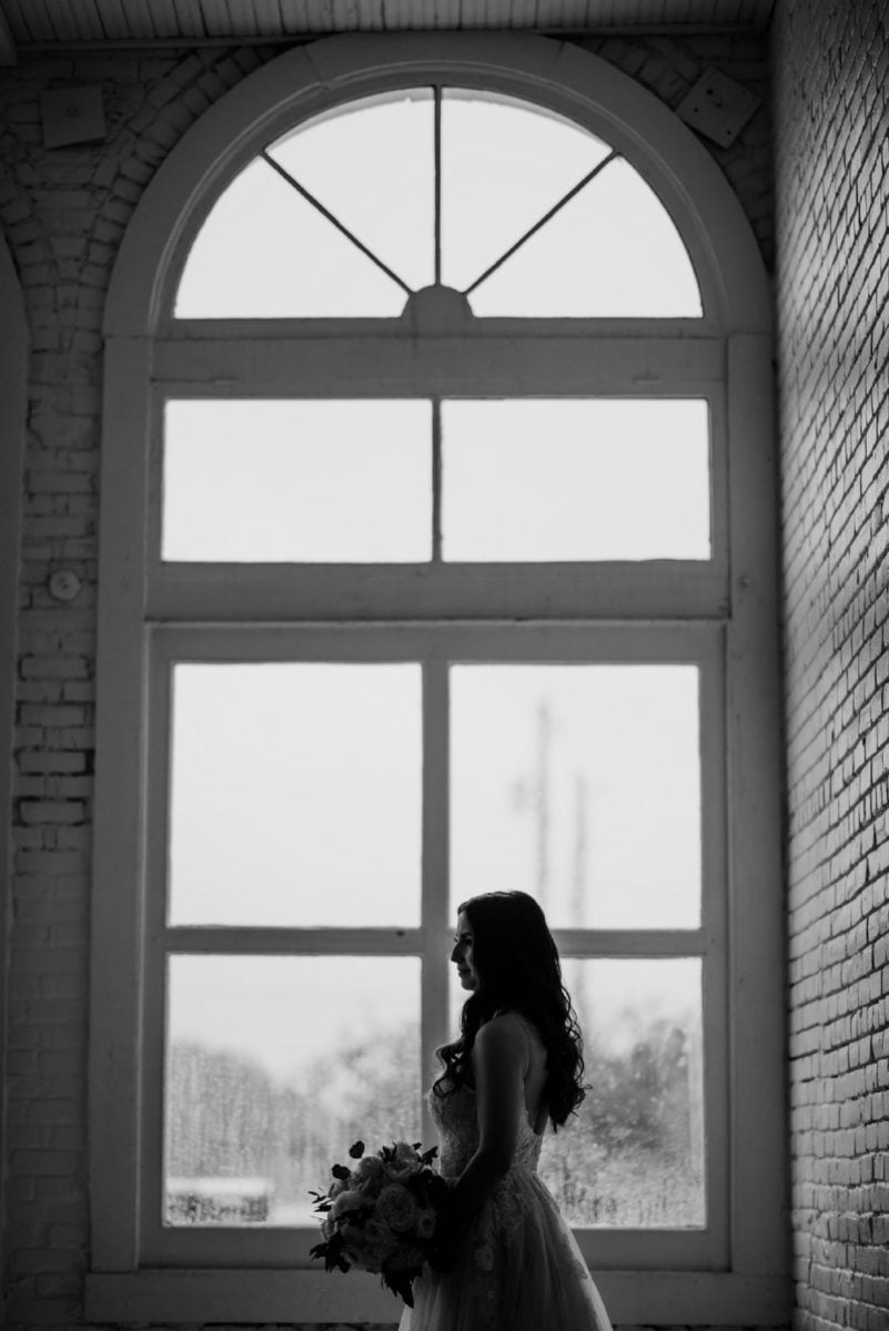 silhouette of bride in window