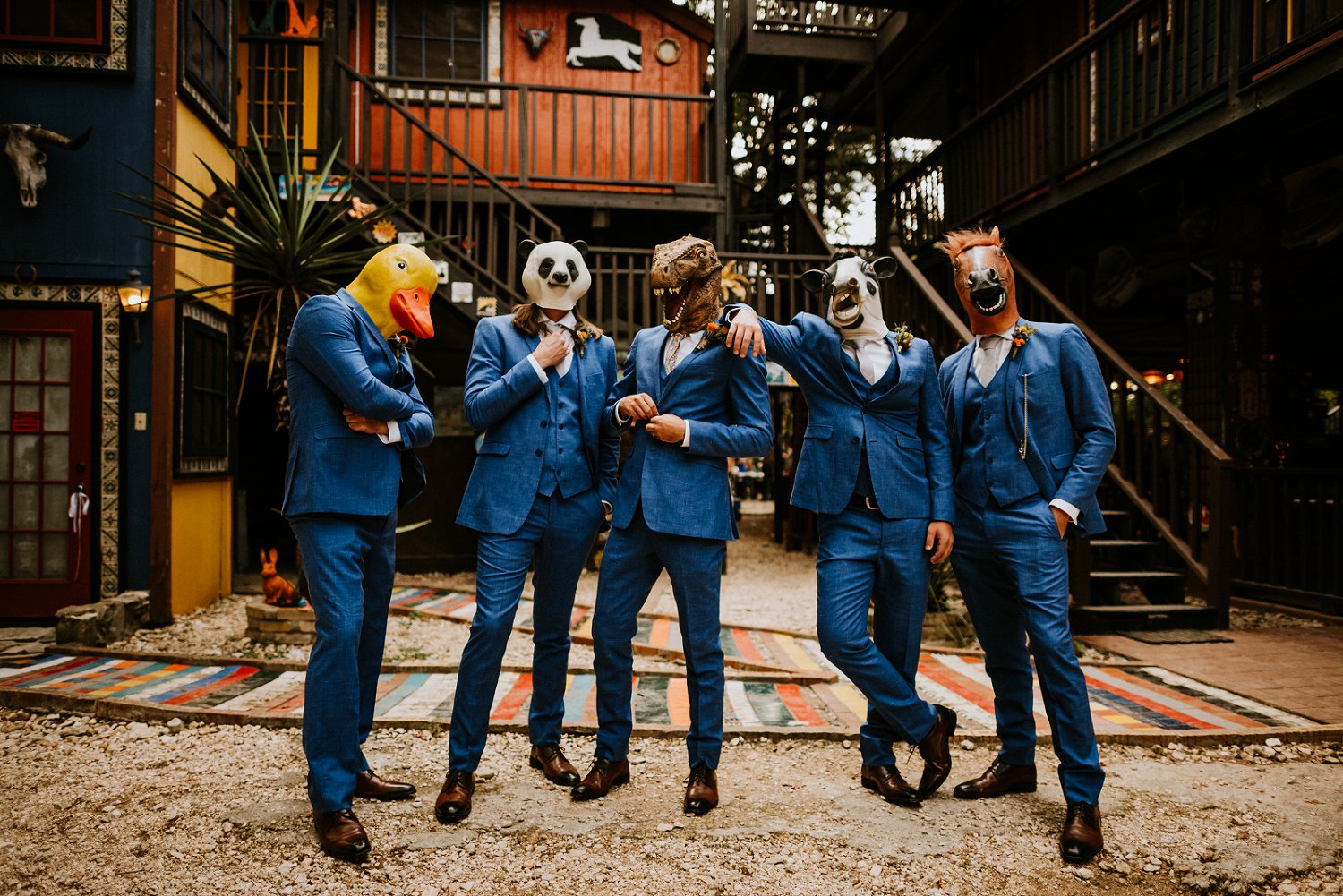 grooms in blue suits and animal heads
