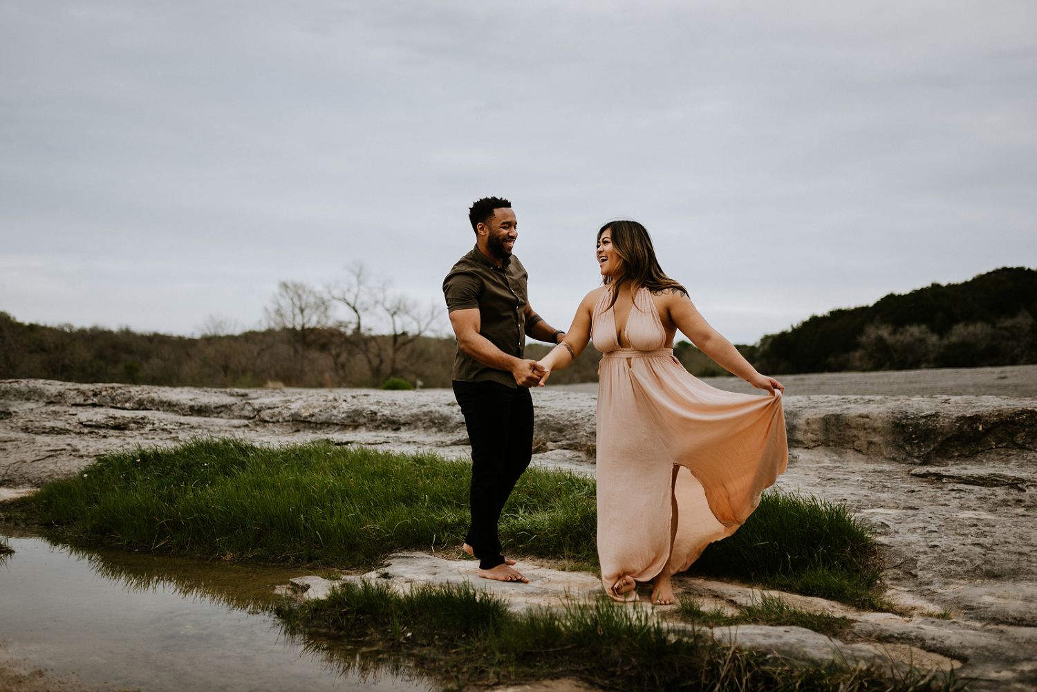 couple spinning around during engagement session