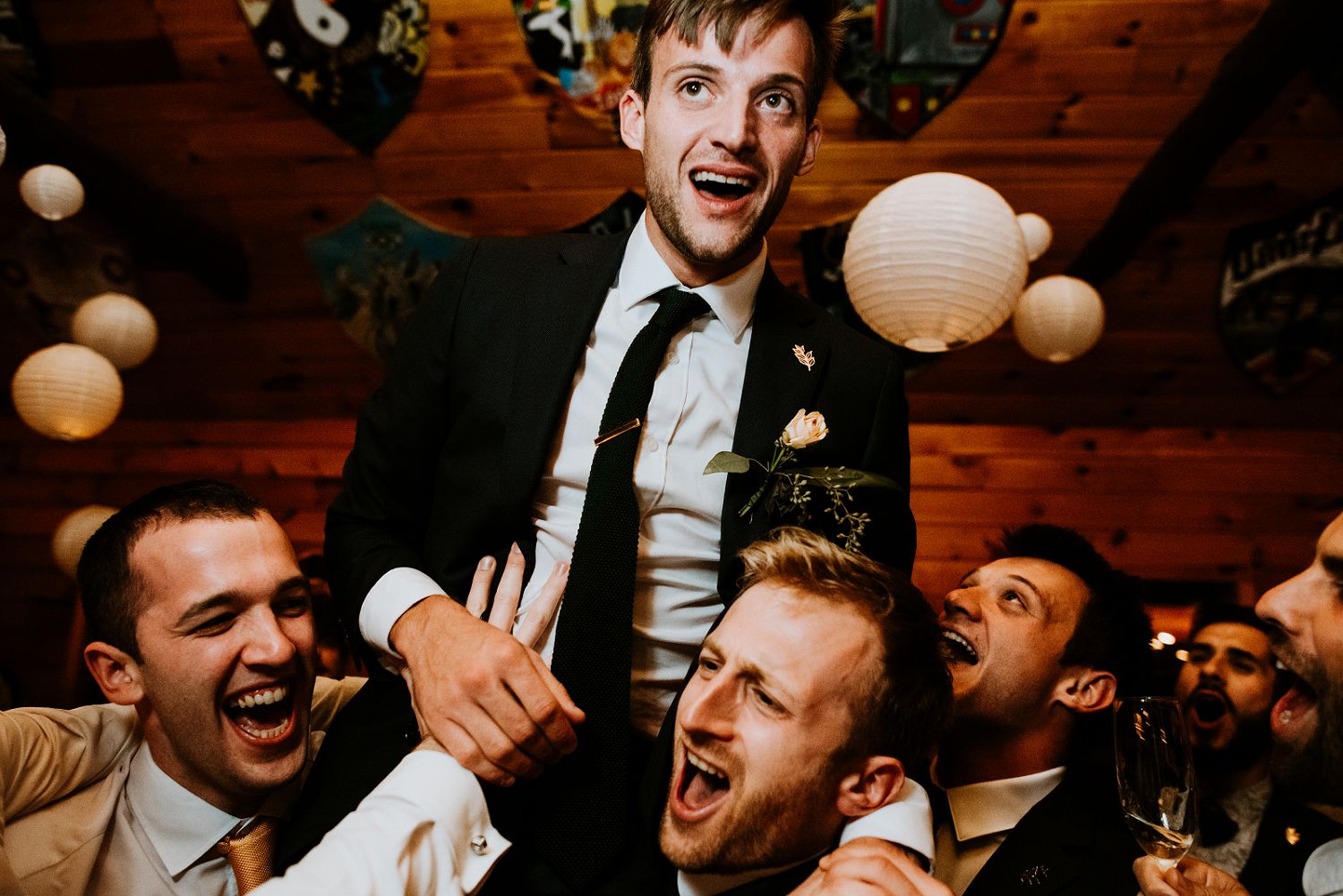 groom on shoulders reception