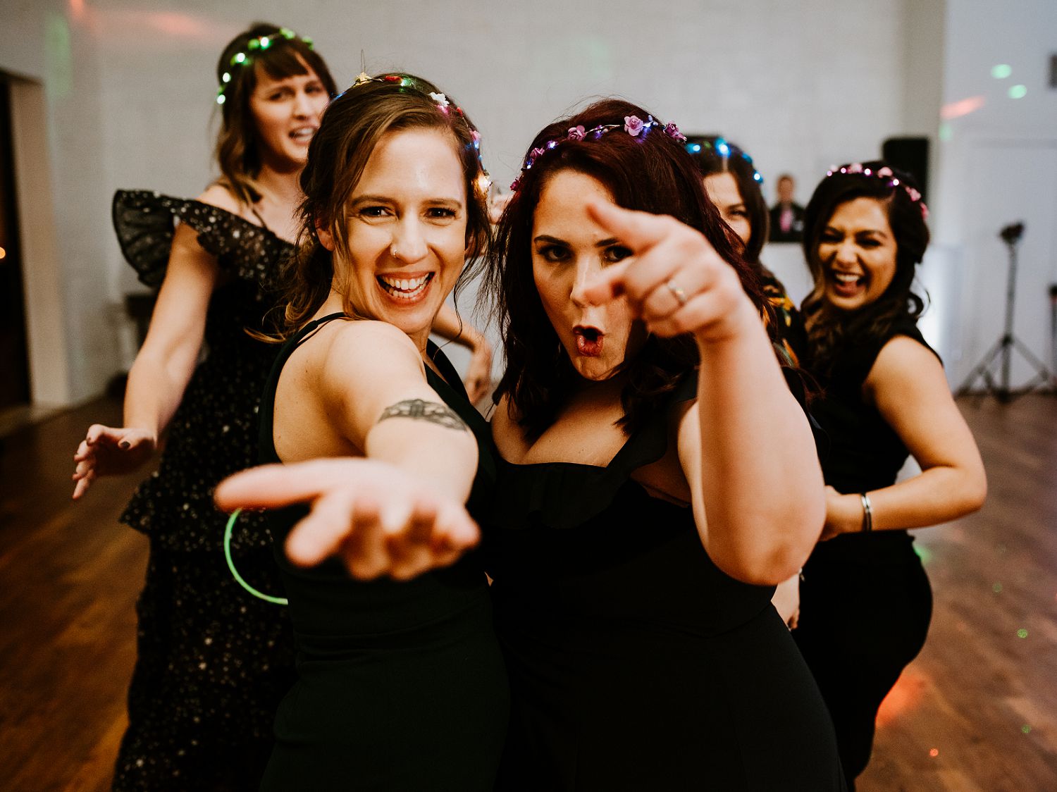 bridesmaids dance in front of camera