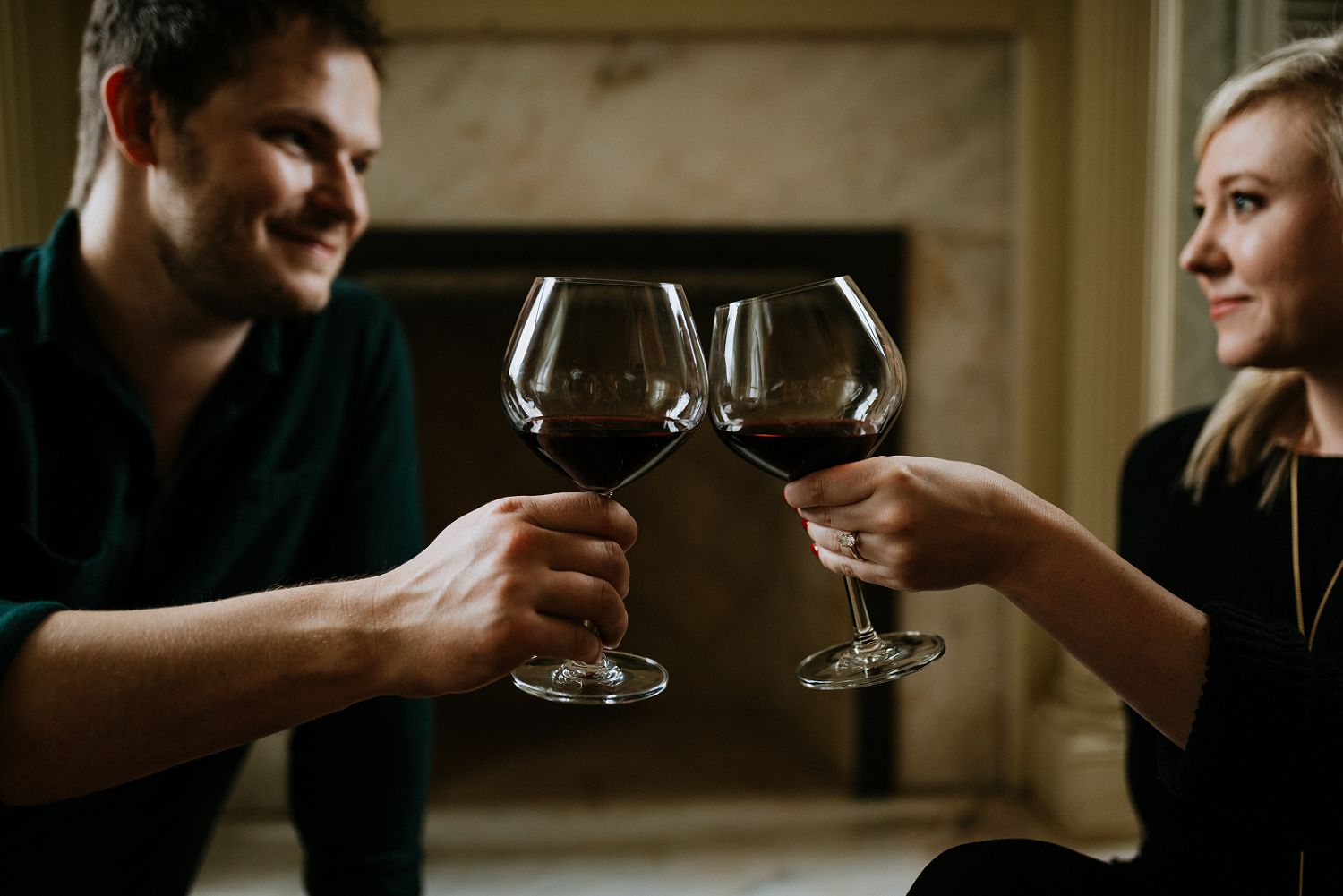 couple drinks wine during engagement session