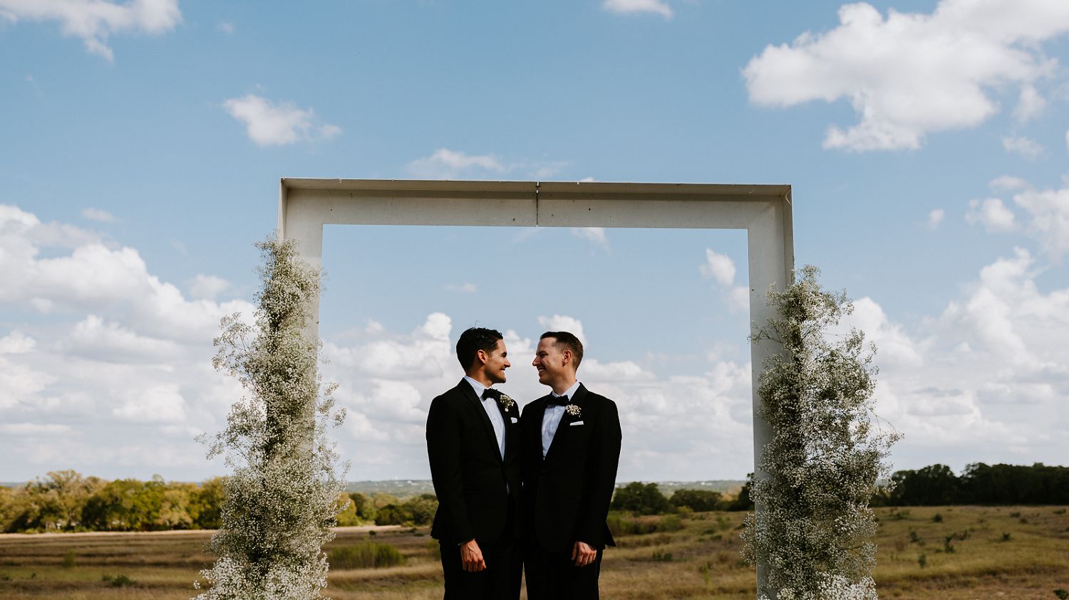 grooms get married at Prospect House venue in Dripping Springs