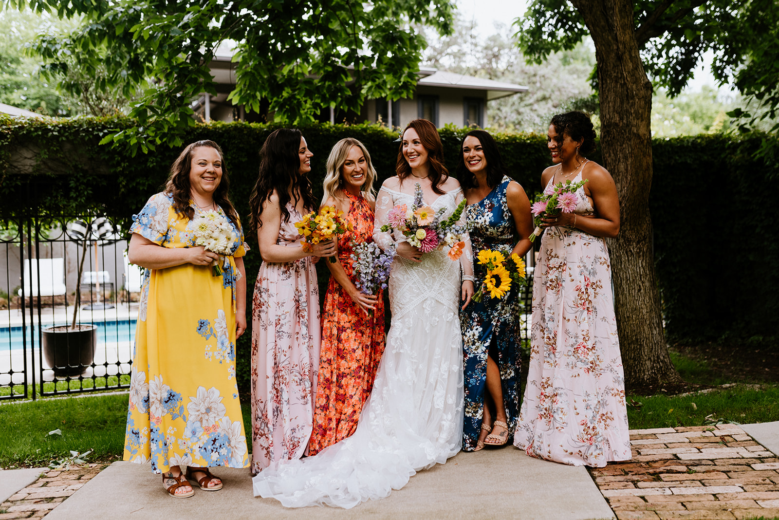 bridesmaids with colorful floral dresses