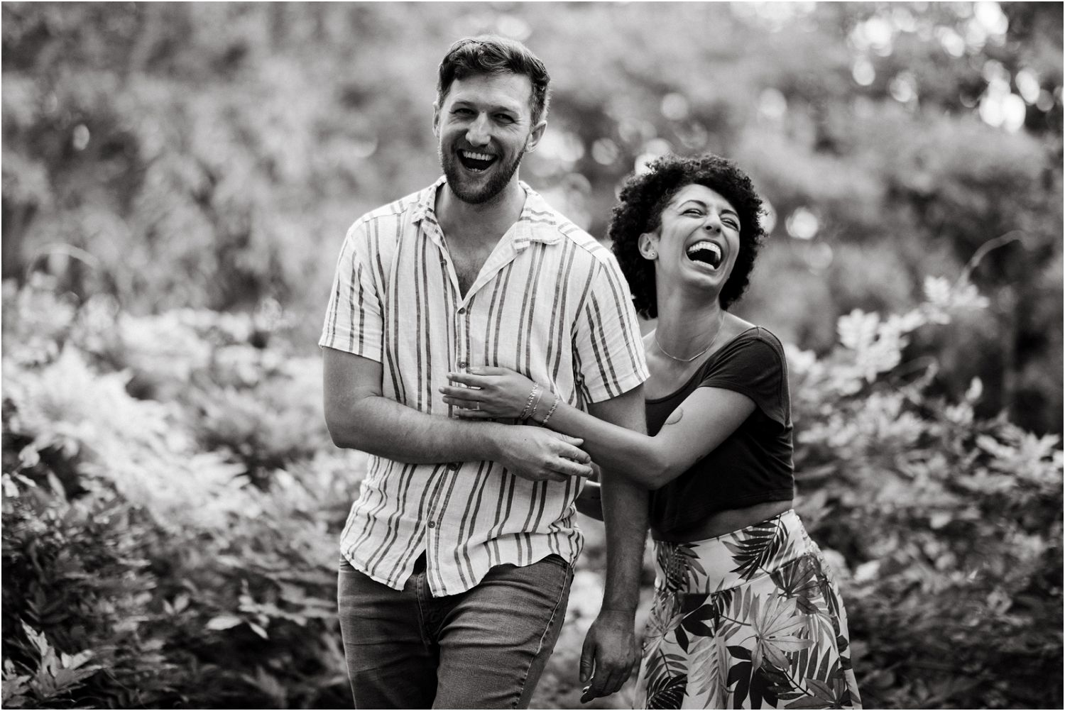 couple laughing together during engagement session