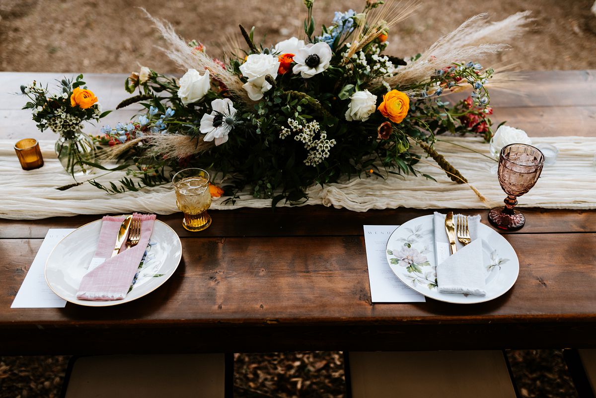 aerial photo of head table with florals and china