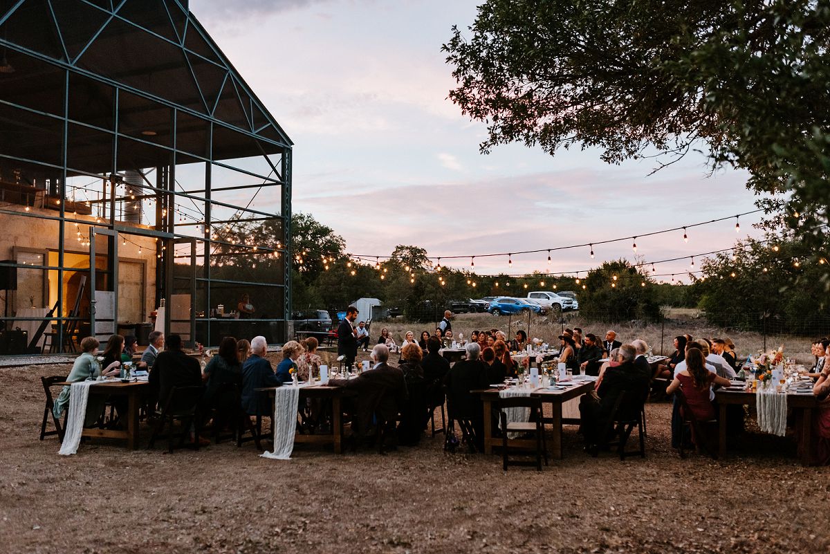 sunset photo of guests sitting at tables