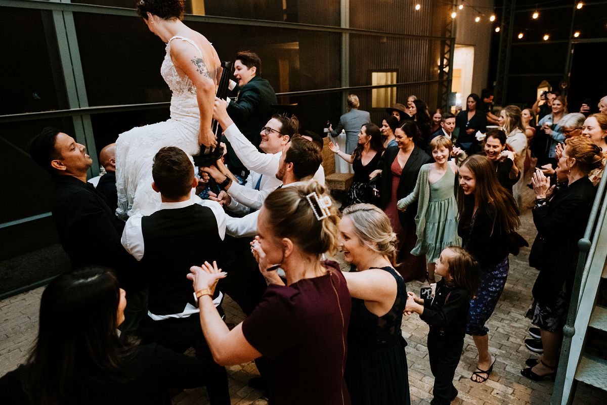 guest putting down bride after Hora