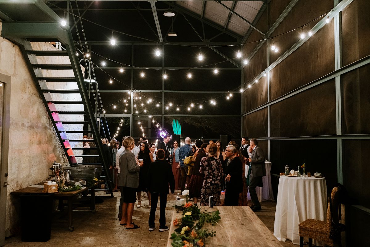 wide photo inside venue of guests during reception