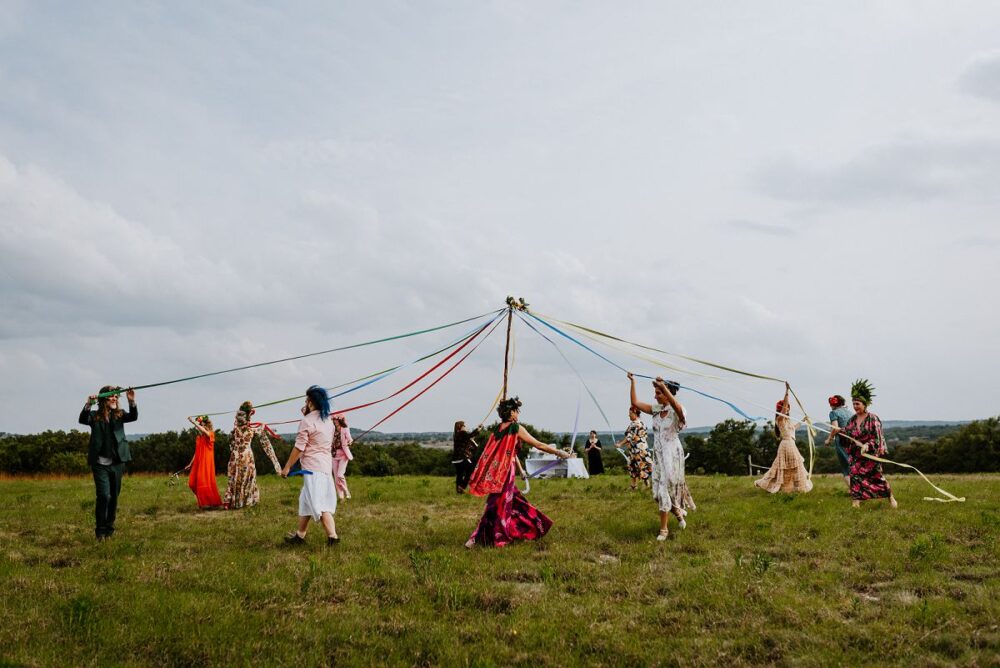 people dancing around during May Pole