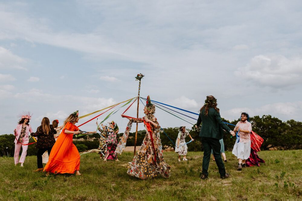 people dancing around during May Pole