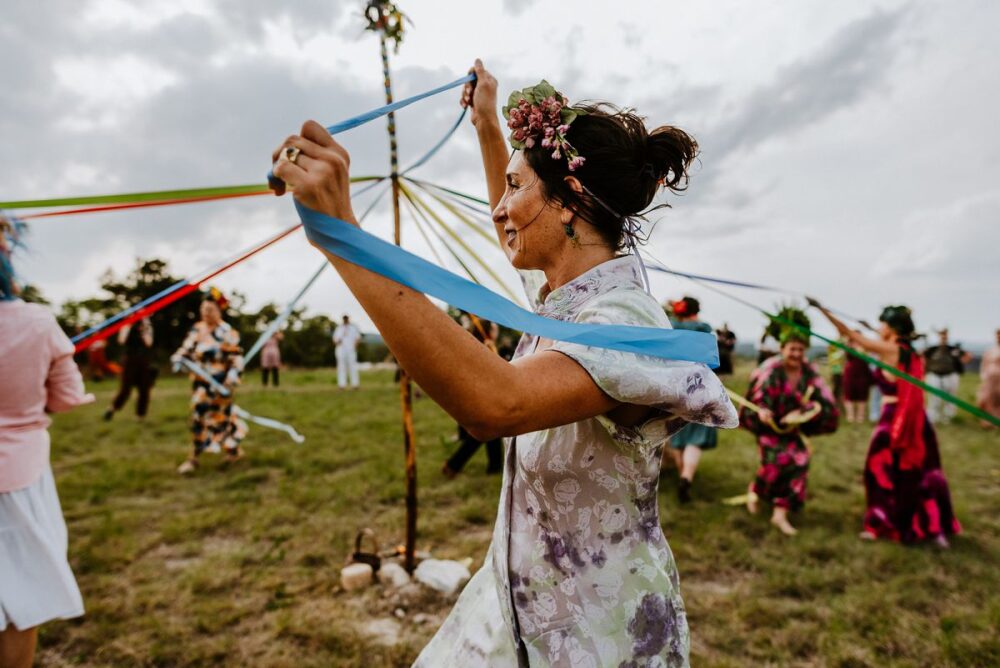 people dancing around during May Pole