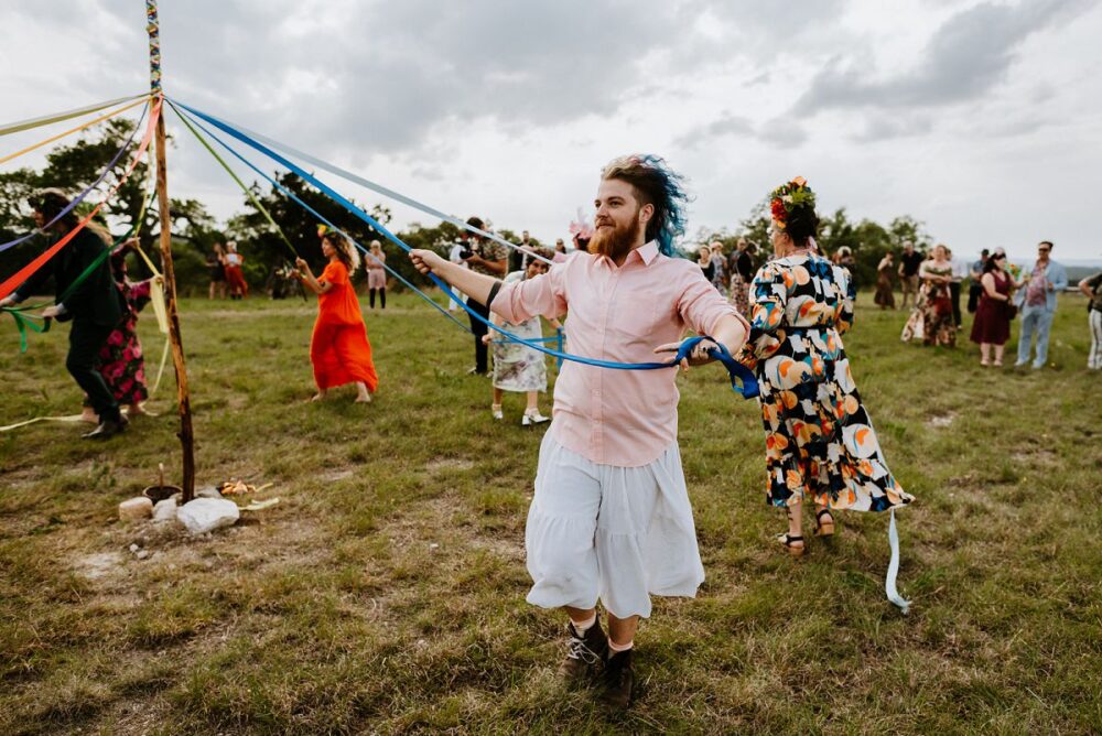 people dancing around during May Pole