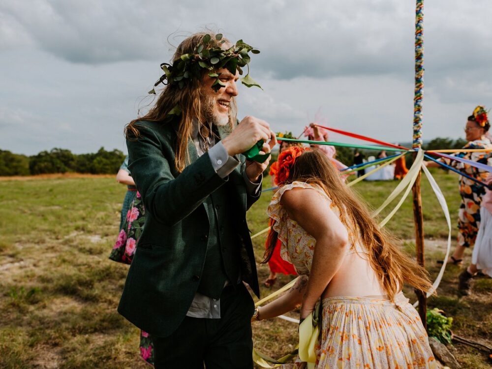 people dancing around during May Pole