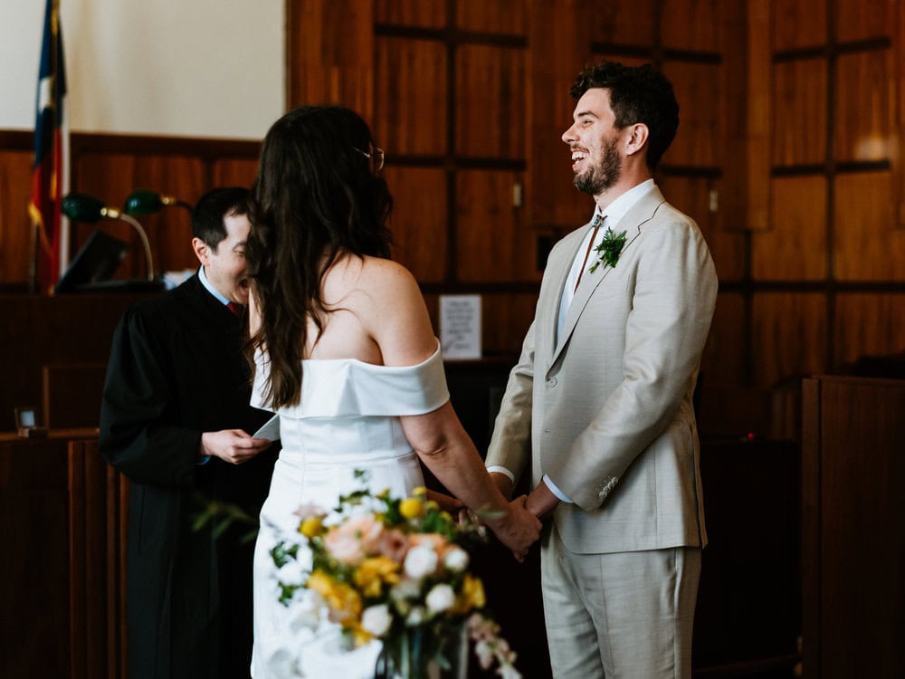 groom smiling during elopement in courthouse