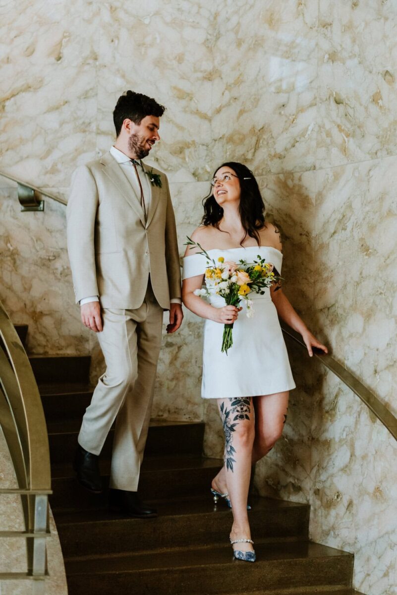 couple walking down stairs in courthouse