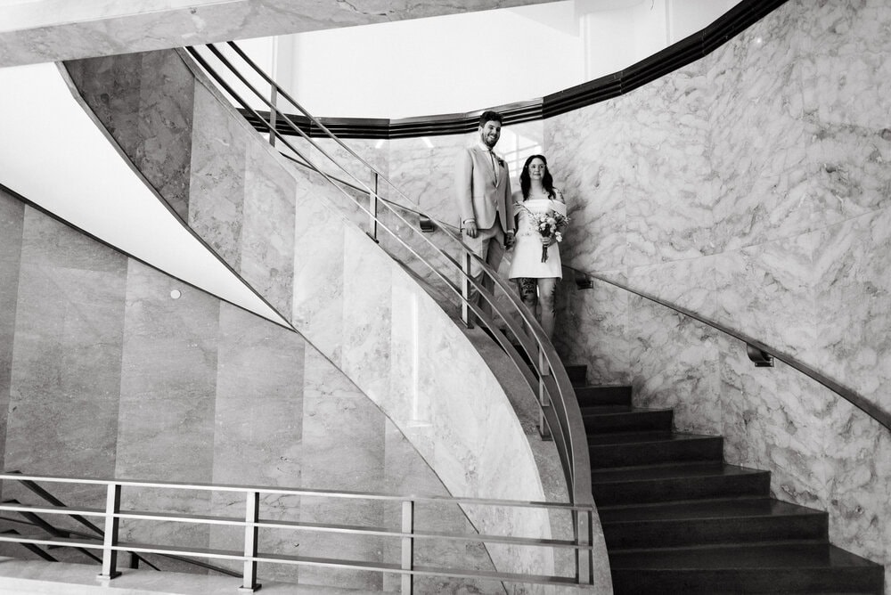 couple walking down stairs in courthouse