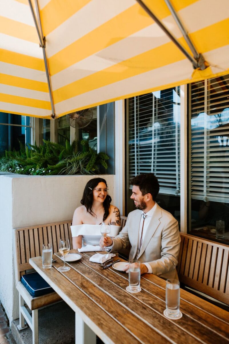 couple smiling at each other at clarks oyster bar