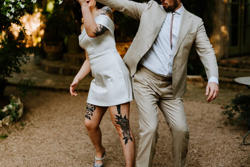 couple giving a booty bump while walking