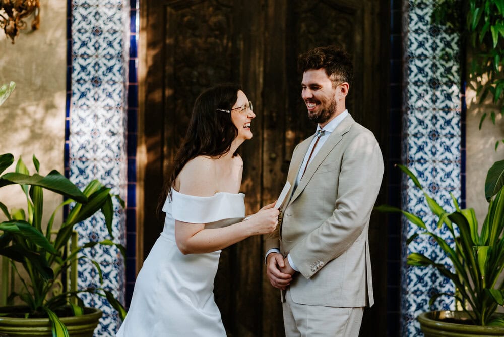 couple sharing private vows and laughing at jennifers garden in austin