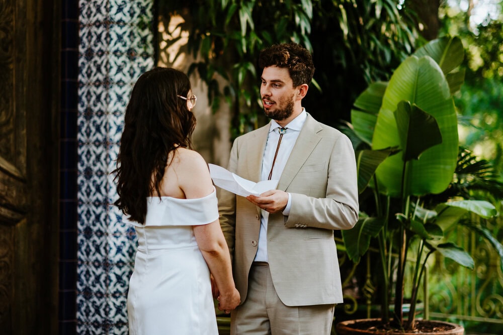couple sharing private vows at jennifers garden in austin