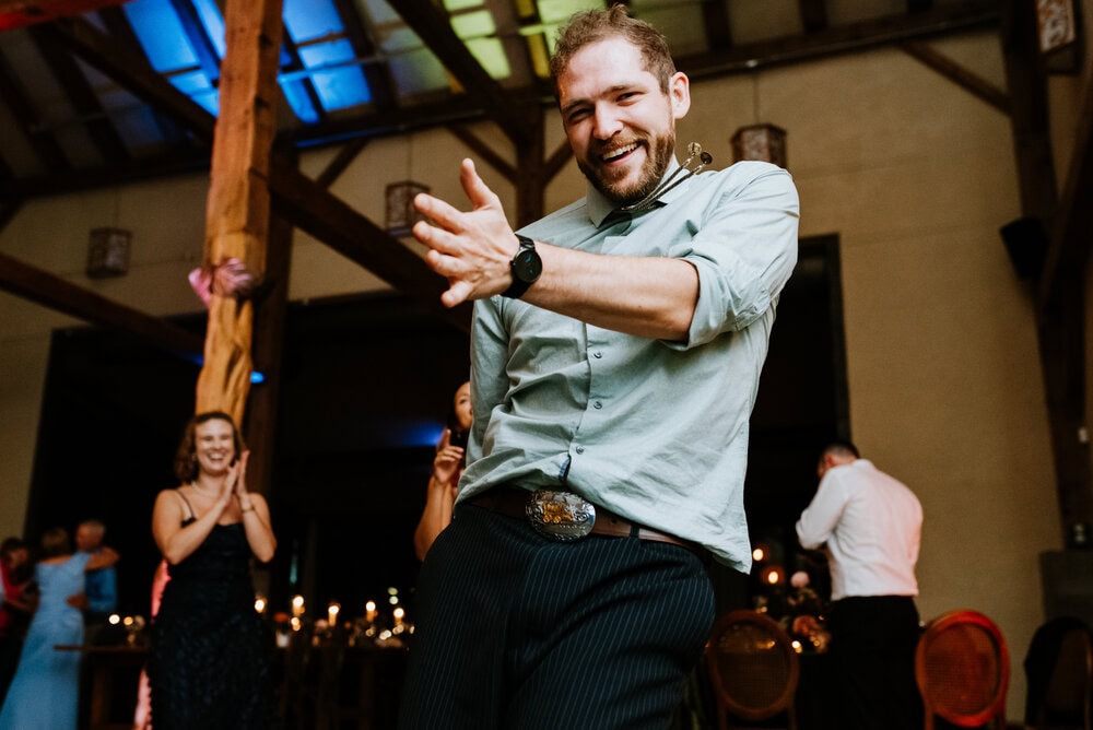 direct flash photo of guests dancing during wedding reception