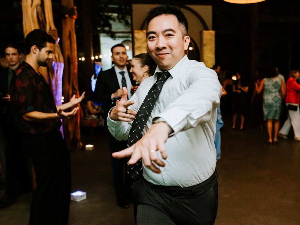 direct flash photo of guests dancing during wedding reception