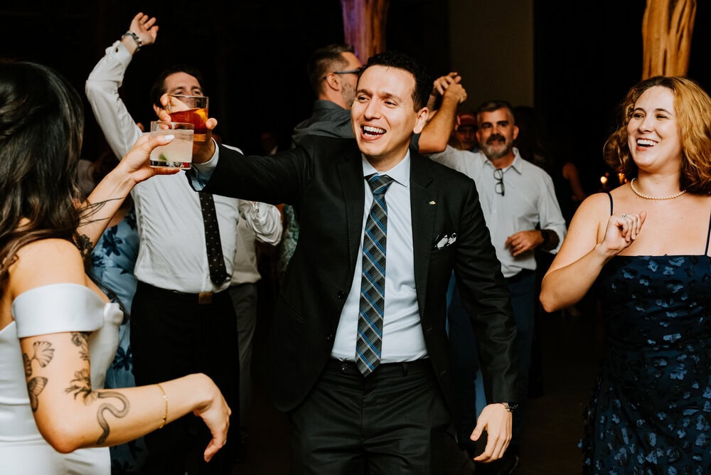 direct flash photo of guests dancing during wedding reception