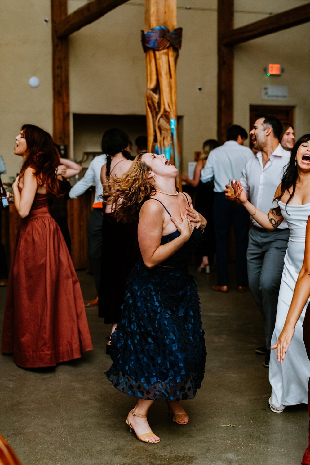 direct flash photo of guests dancing during wedding reception
