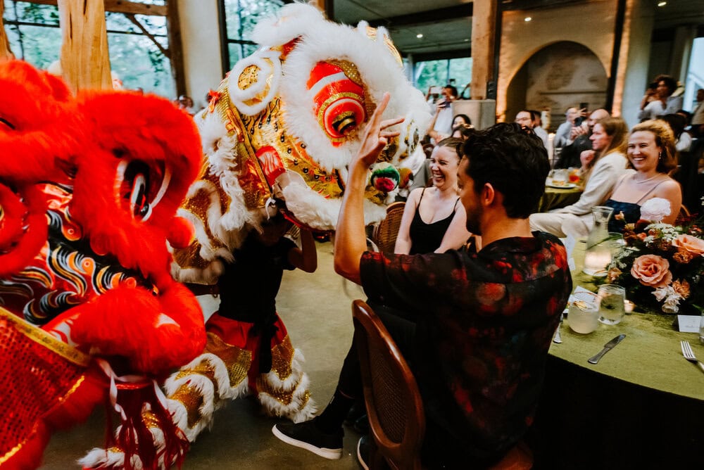 lion dancers during wedding reception