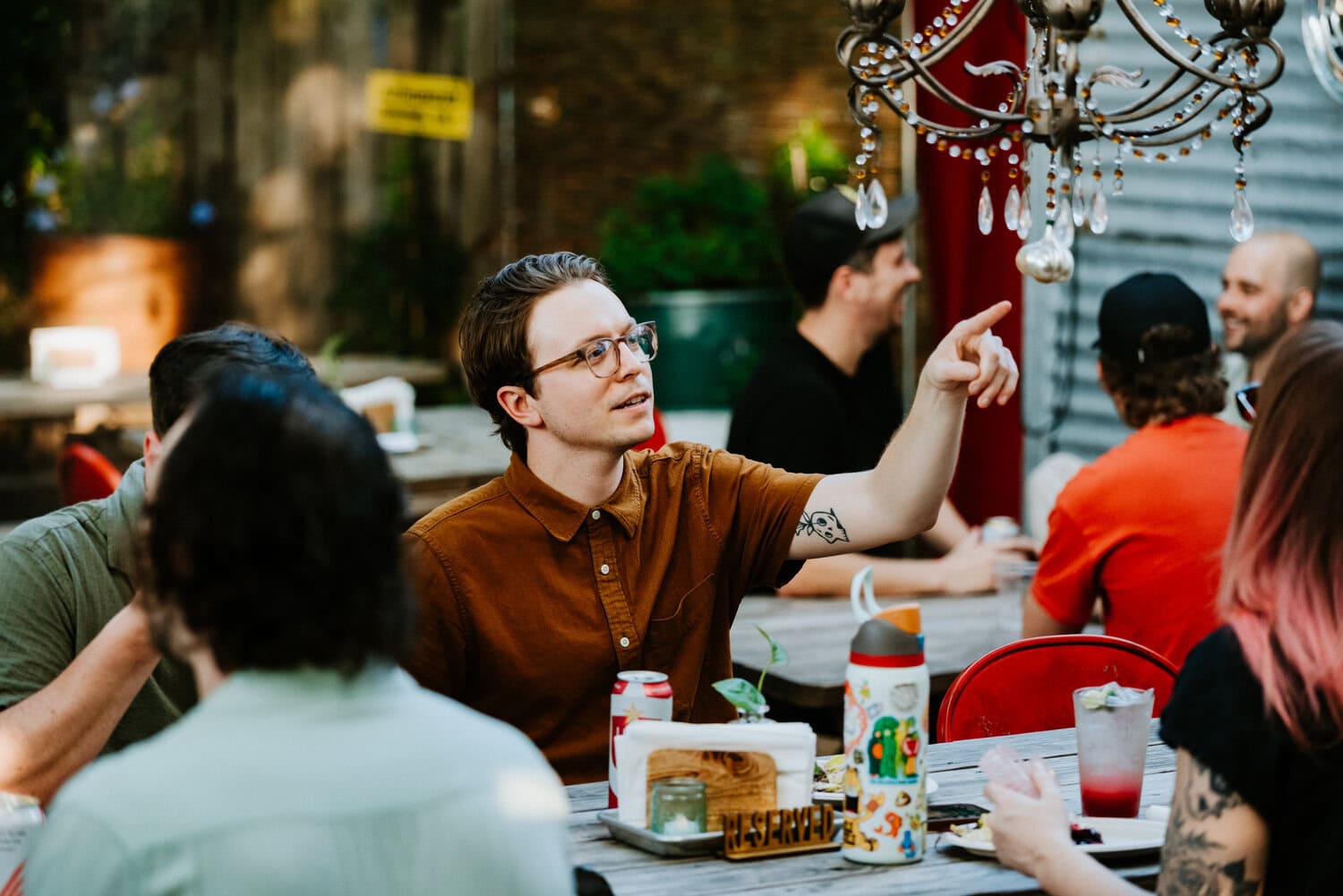 people hugging outdoors as they welcome each other for casual reception