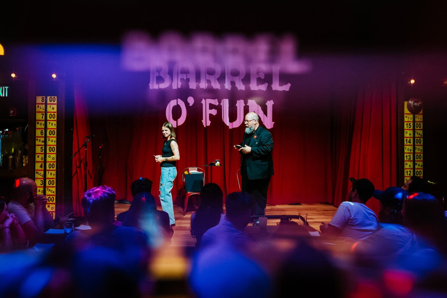 Brad Henderson standing on stage in Barrel O' Fun performing magician act