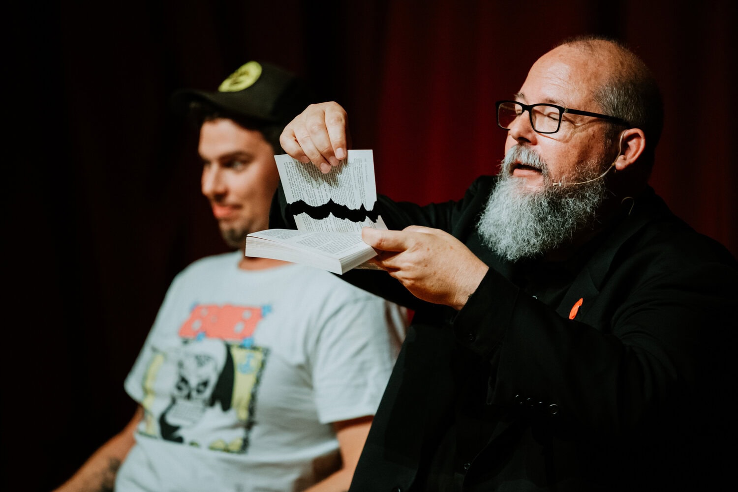 Brad Henderson performing magician act on stage at Barrel O' Fun 