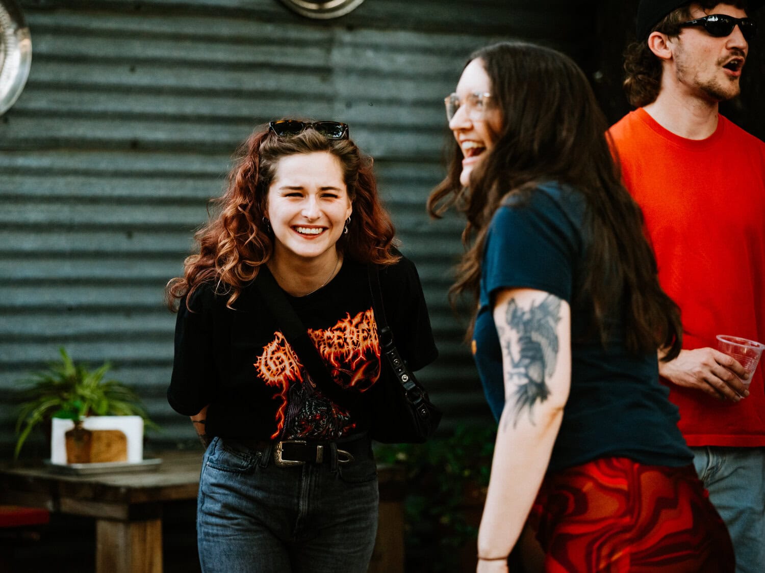 people hugging outdoors as they welcome each other for casual reception